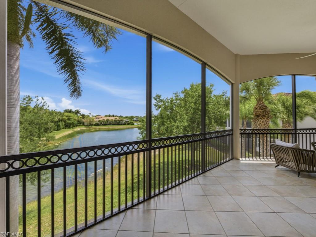 28511 Calabria Court, Unit 202 Naples, FL 34110 - Photo 24 of 44 a city view from a balcony