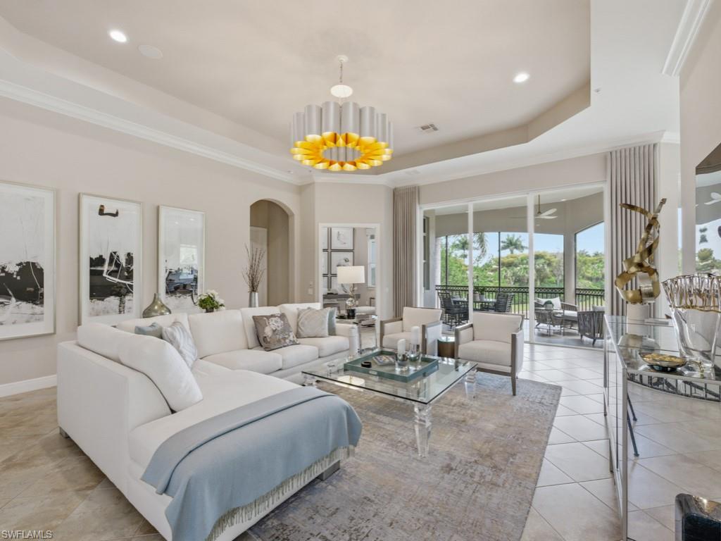 28511 Calabria Court, Unit 202 Naples, FL 34110 - Photo 6 of 44 a living room with furniture and a large window