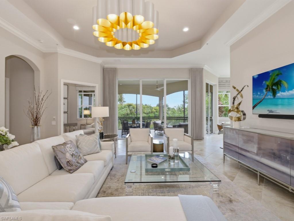 28511 Calabria Court, Unit 202 Naples, FL 34110 - Photo 7 of 44 a living room with furniture and a large window