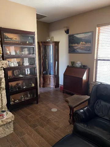 a hallway with furniture and a window