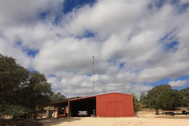 a tall building with trees in front of it