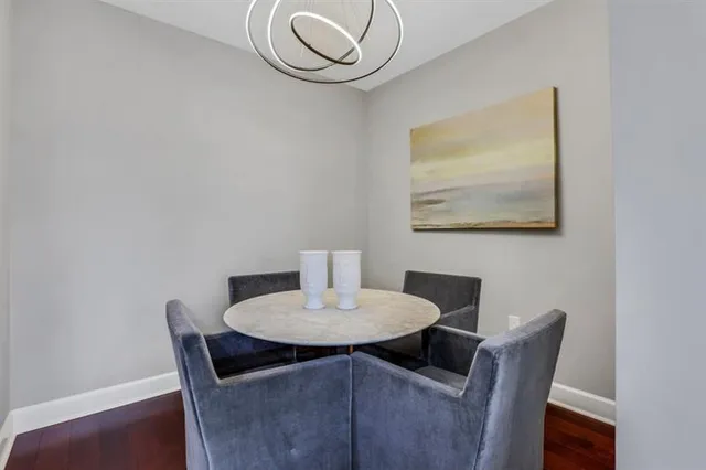 a dining room with furniture and wooden floor