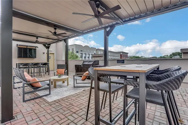 a swimming pool with outdoor seating and city view