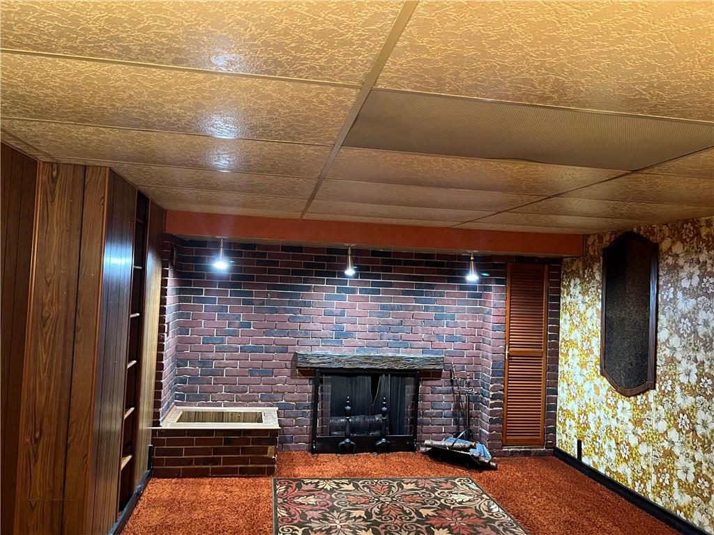 610 Walnut Drive Donora, PA 15033 - Photo 12 of 16 a room with fireplace and wooden floor