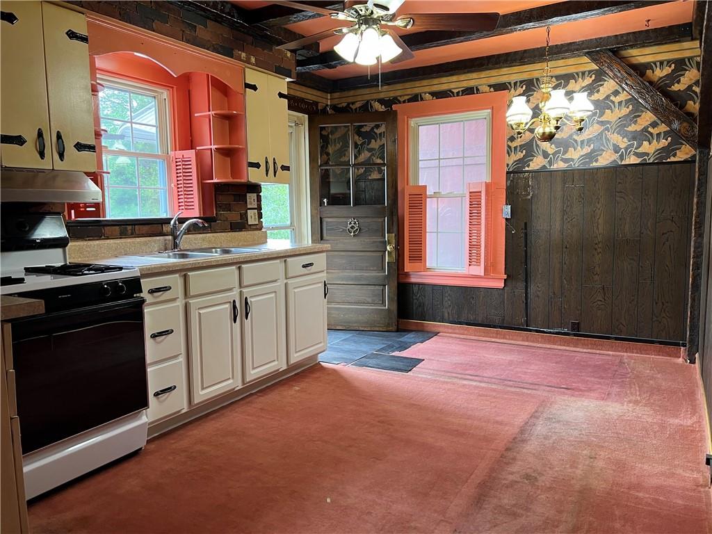 610 Walnut Drive Donora, PA 15033 - Photo 6 of 16 a view of a kitchen with a sink and a window