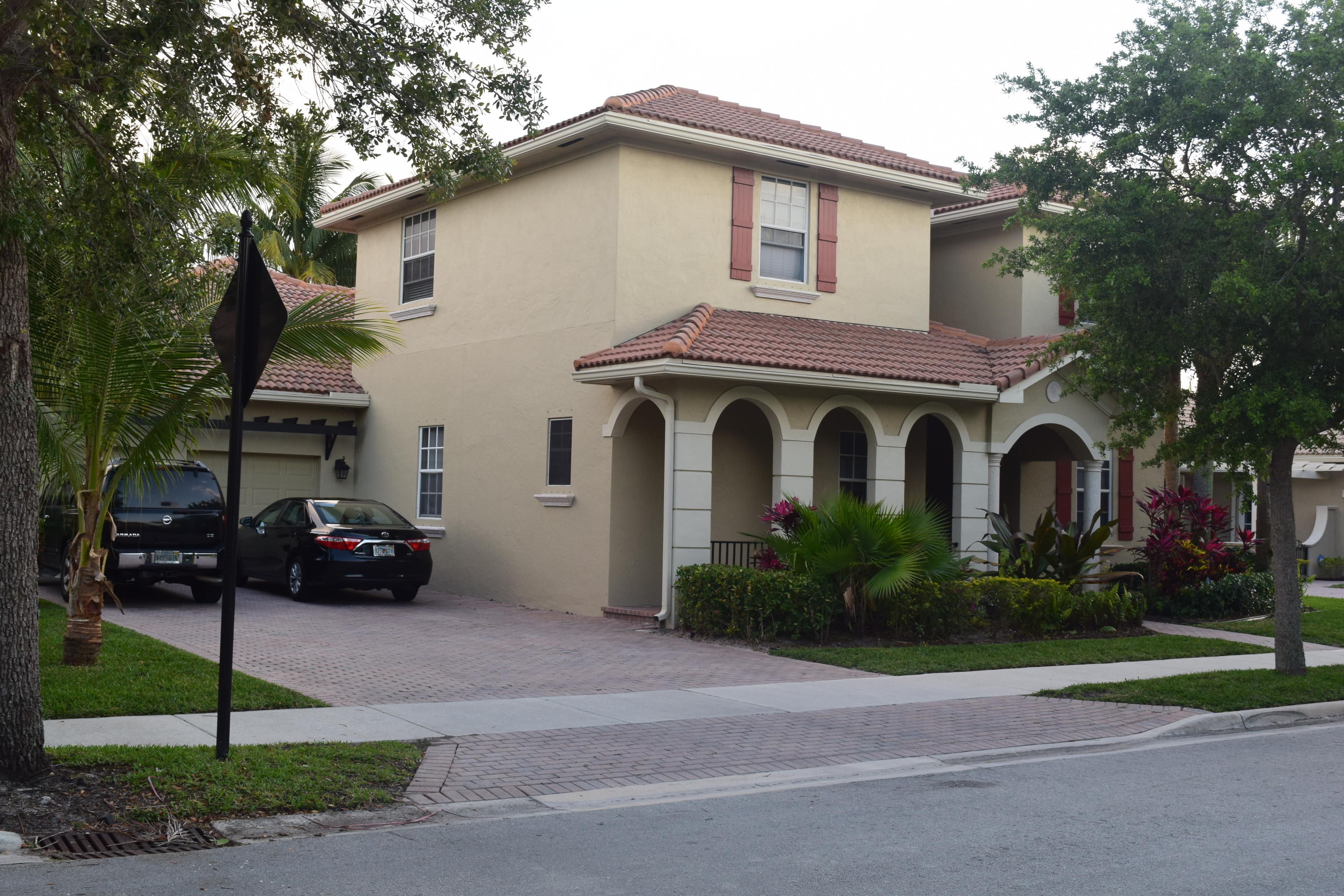 132 Via Isabela Jupiter, FL 33458 - Photo 1 of 27 a front view of a house with garden