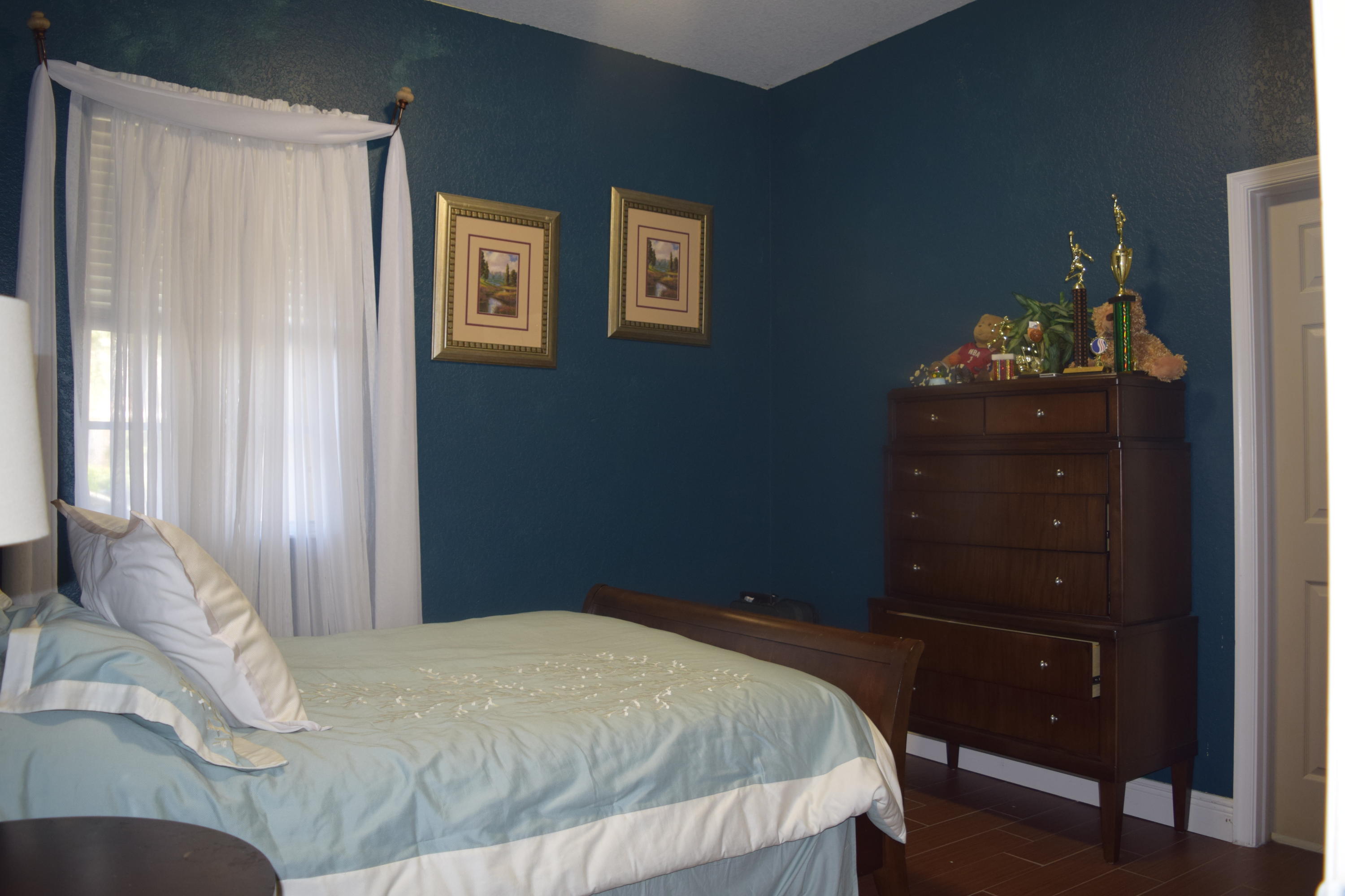 132 Via Isabela Jupiter, FL 33458 - Photo 15 of 27 a bedroom with a bed and a dresser