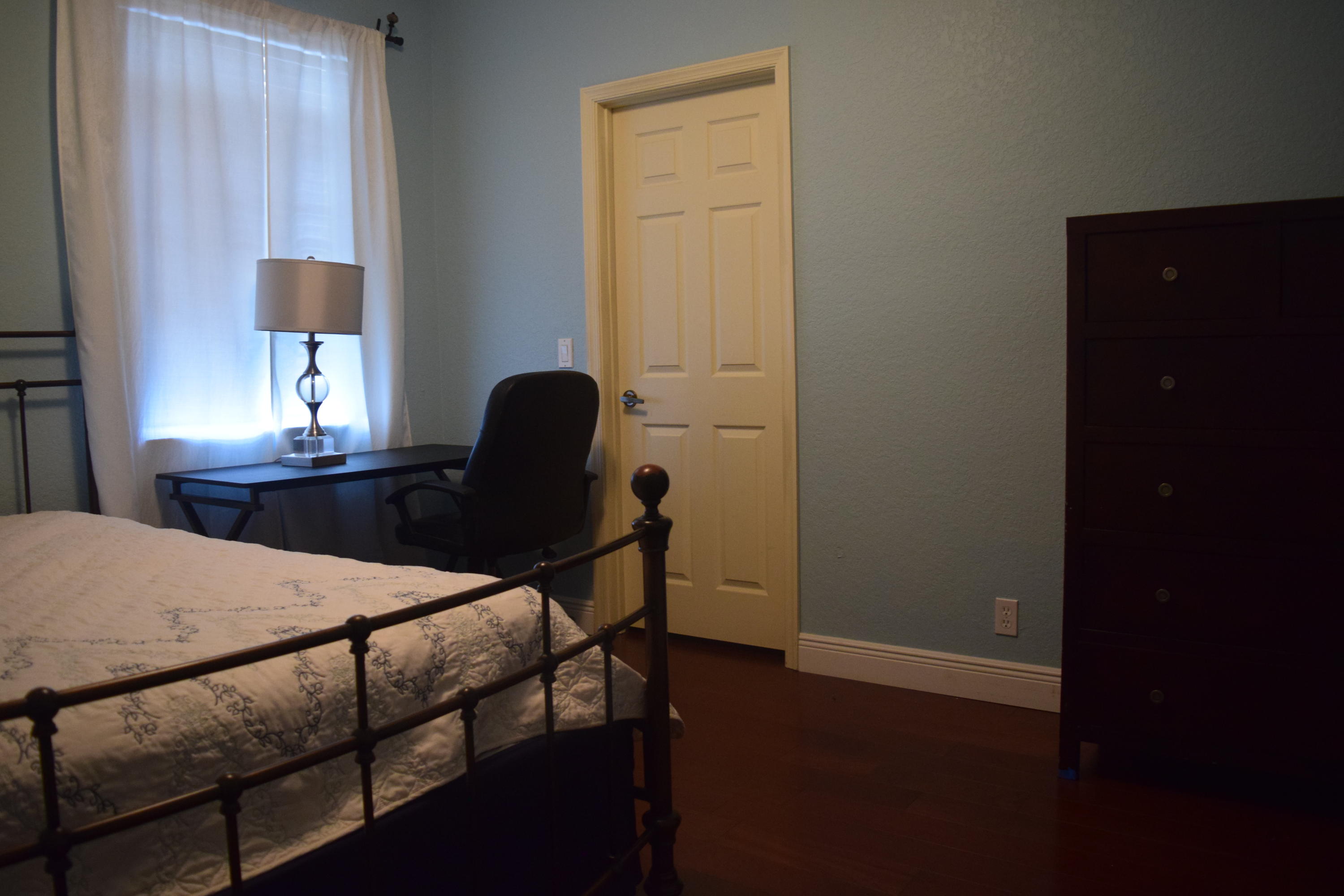 132 Via Isabela Jupiter, FL 33458 - Photo 20 of 27 a bedroom with a bed and a table in it