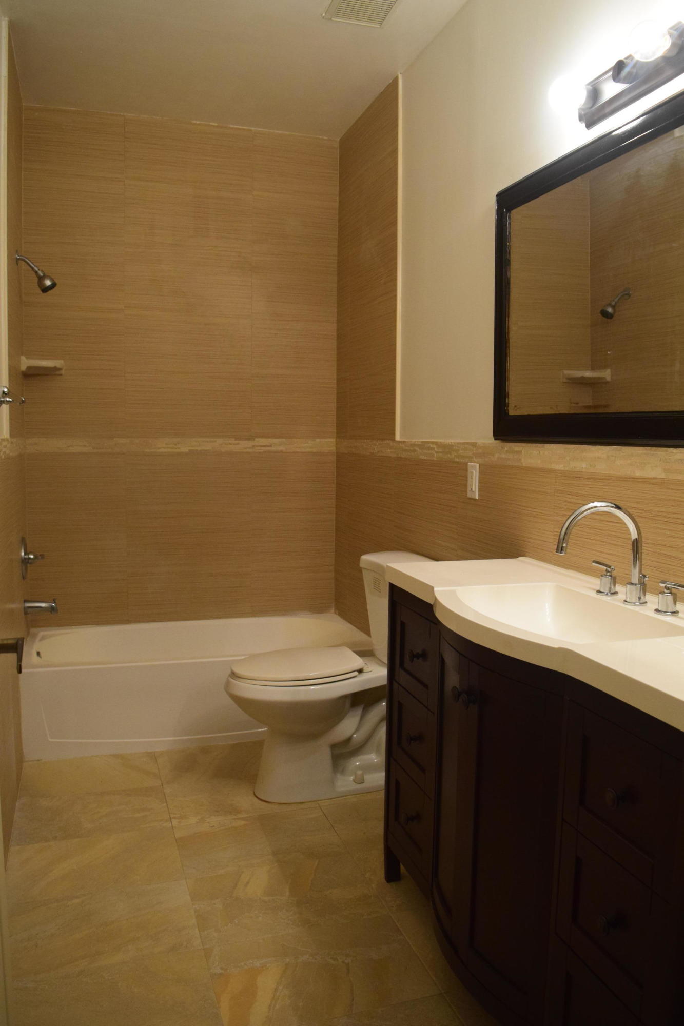132 Via Isabela Jupiter, FL 33458 - Photo 21 of 27 a bathroom with a granite countertop toilet sink and mirror