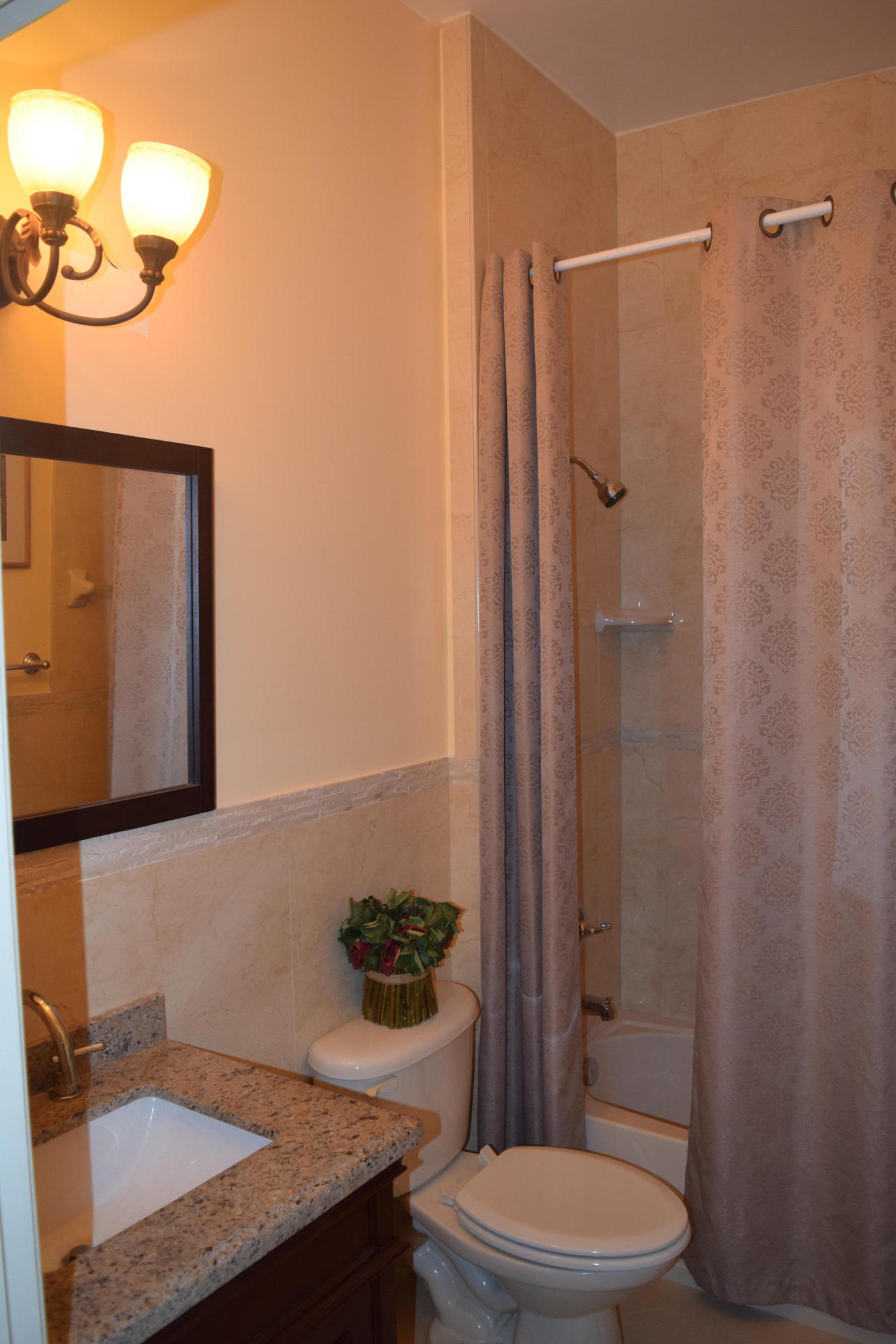 132 Via Isabela Jupiter, FL 33458 - Photo 23 of 27 a bathroom with a granite countertop sink toilet and shower