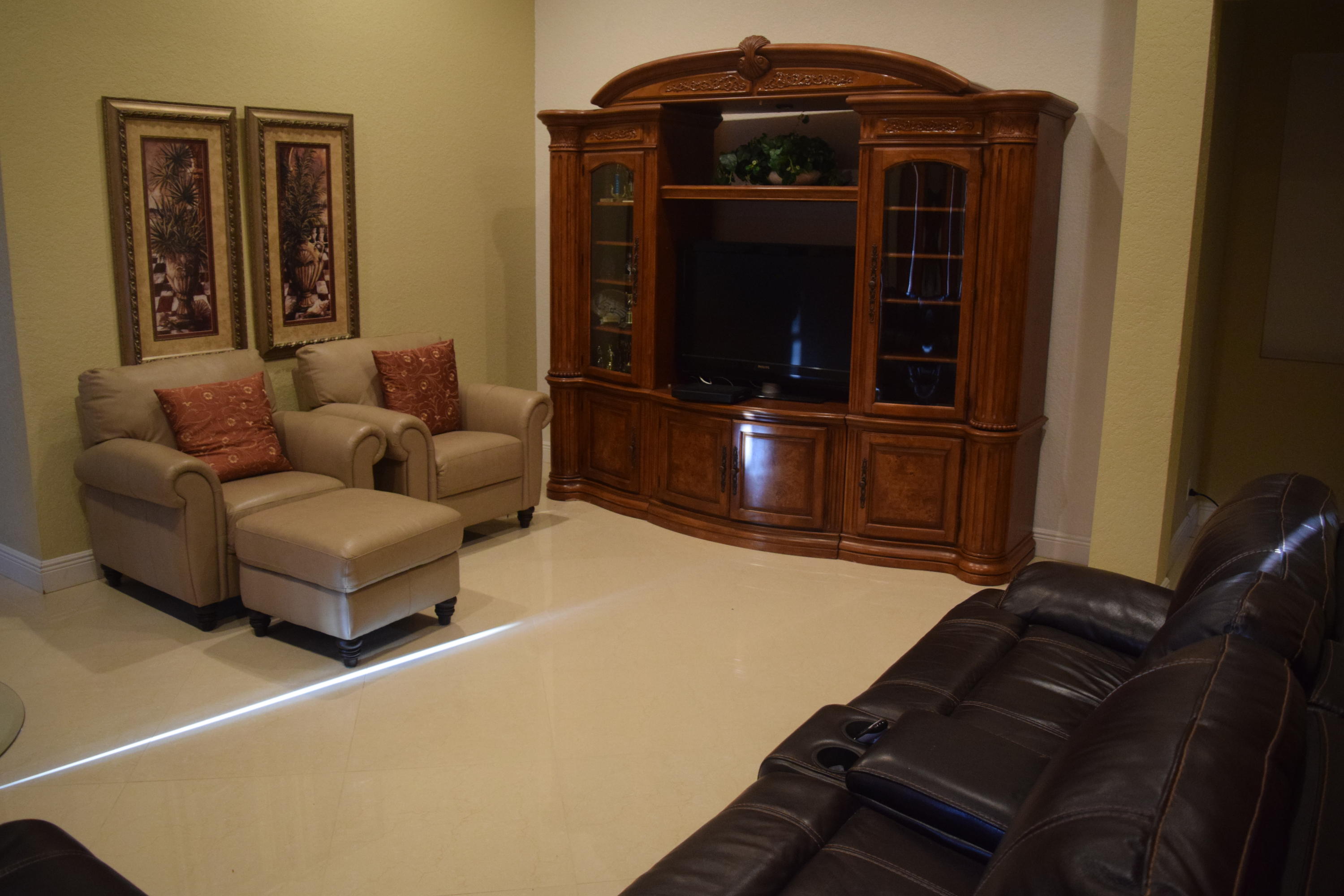 132 Via Isabela Jupiter, FL 33458 - Photo 3 of 27 a living room with furniture and a flat screen tv