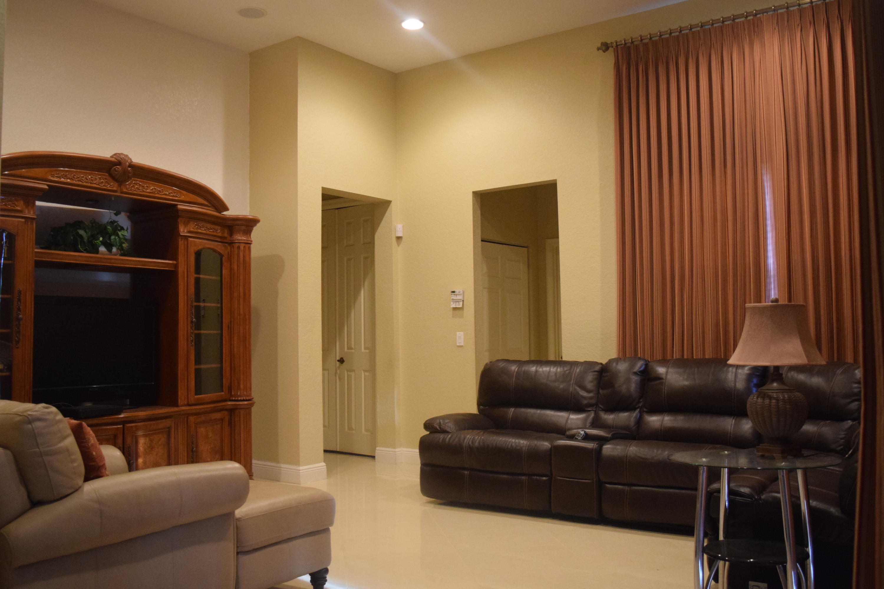 132 Via Isabela Jupiter, FL 33458 - Photo 4 of 27 a living room with furniture and a flat screen tv