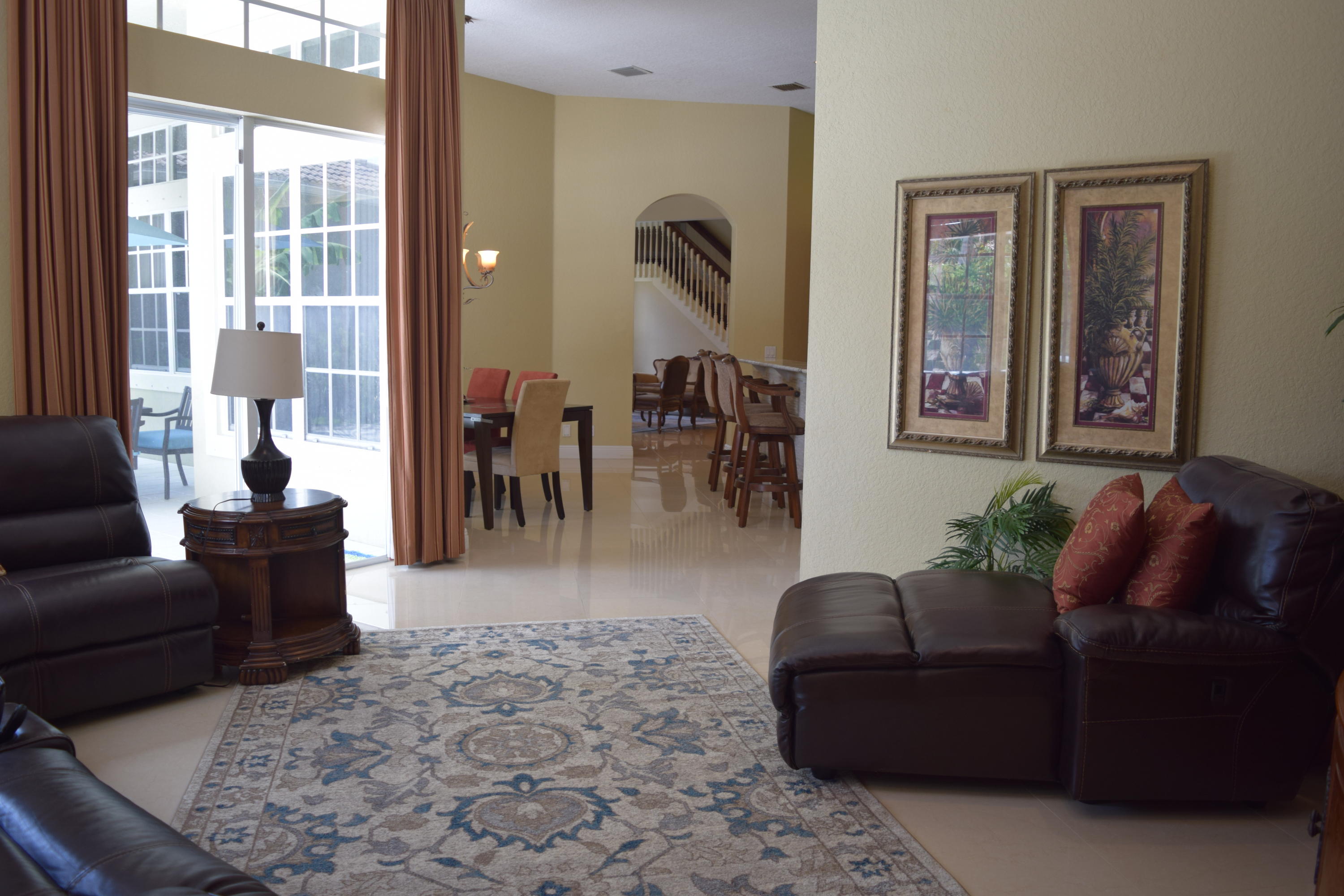 132 Via Isabela Jupiter, FL 33458 - Photo 6 of 27 a living room with furniture and a large window