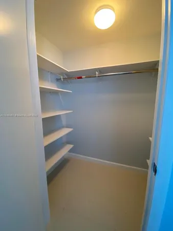 a view of an empty walk in closet