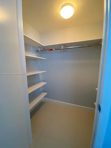 a view of an empty walk in closet