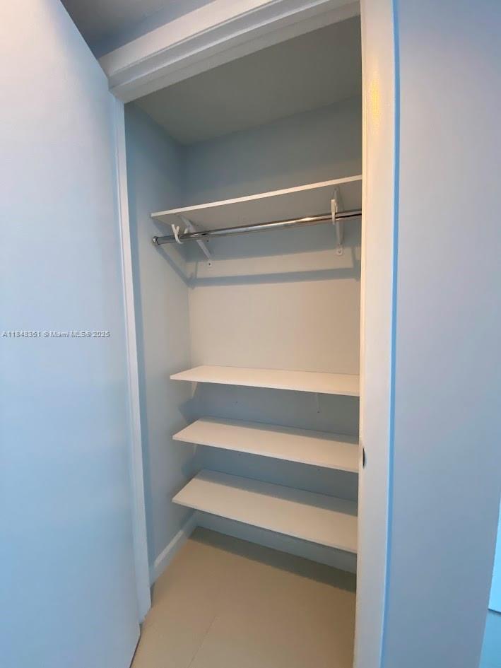 475 Brickell Avenue, Unit 4409 Miami, FL 33131 - Photo 27 of 37 a view of walk in closet with empty racks