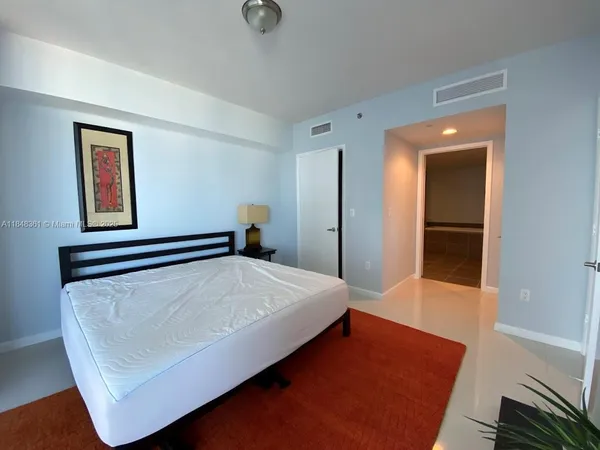 a room with a bed and a window