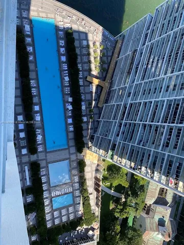 a view of a backyard with sitting area