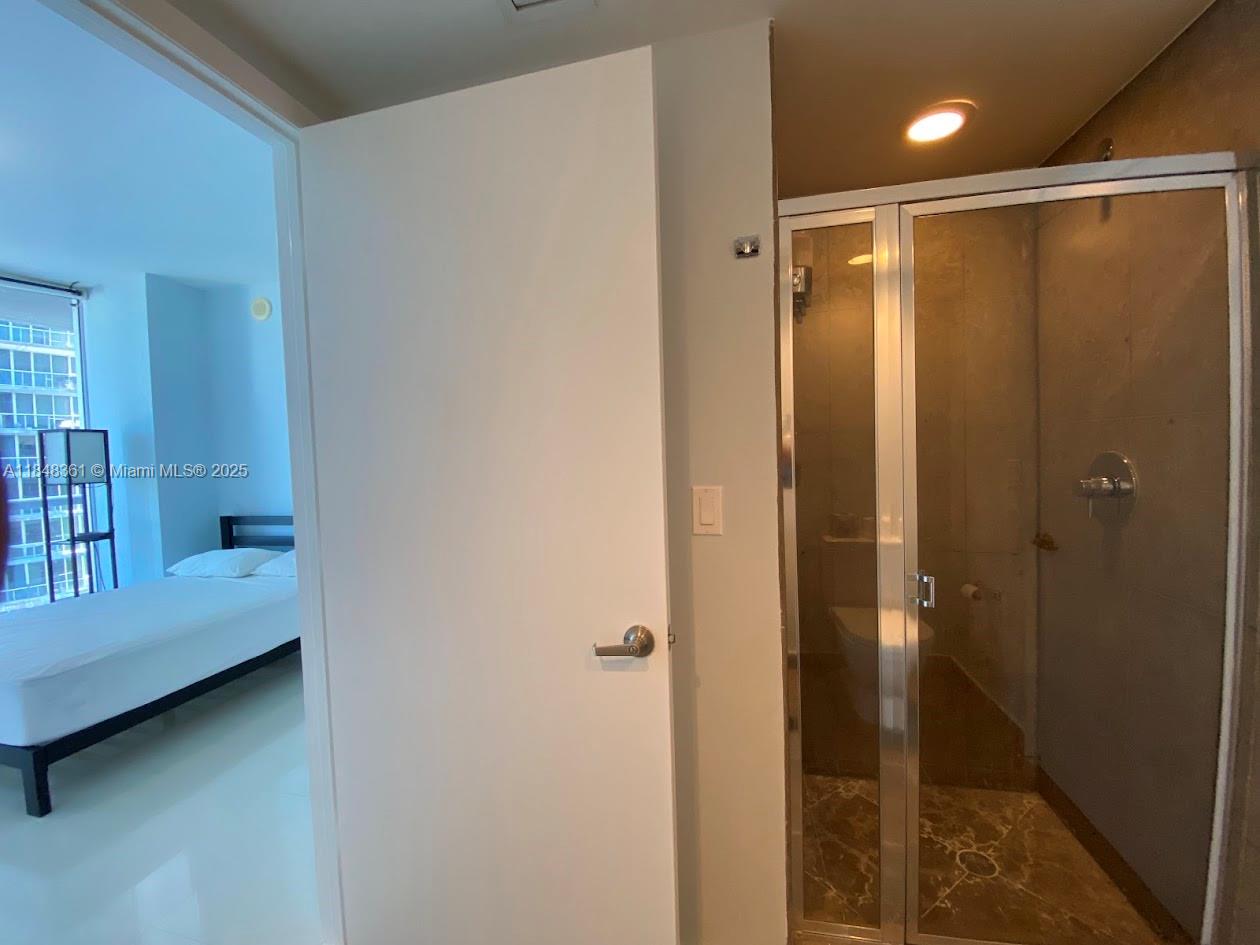 475 Brickell Avenue, Unit 4409 Miami, FL 33131 - Photo 9 of 37 a bathroom with a shower