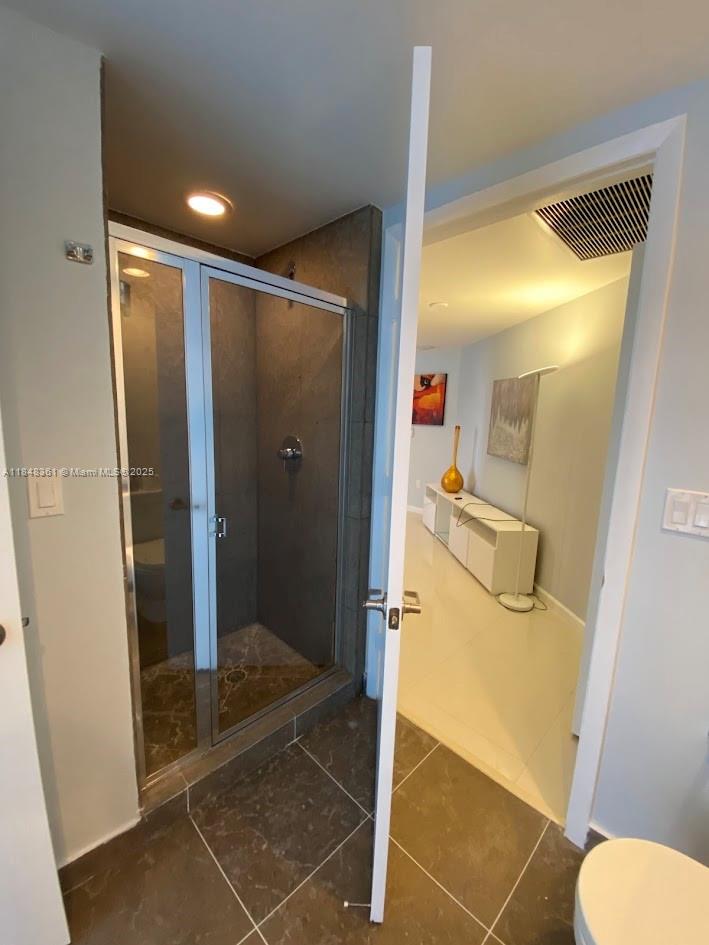 475 Brickell Avenue, Unit 4409 Miami, FL 33131 - Photo 10 of 37 a bathroom with a shower and toilet