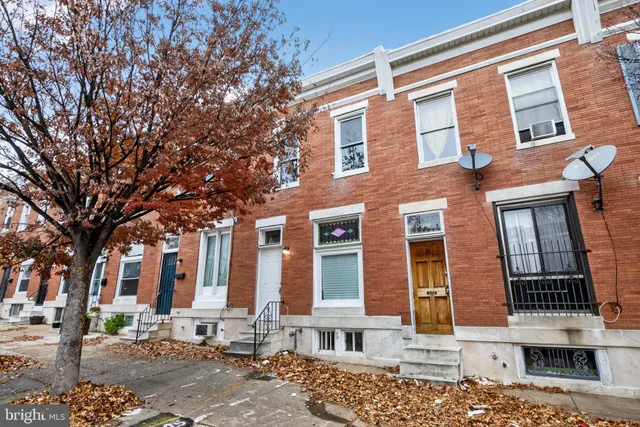 a front view of a building with street view