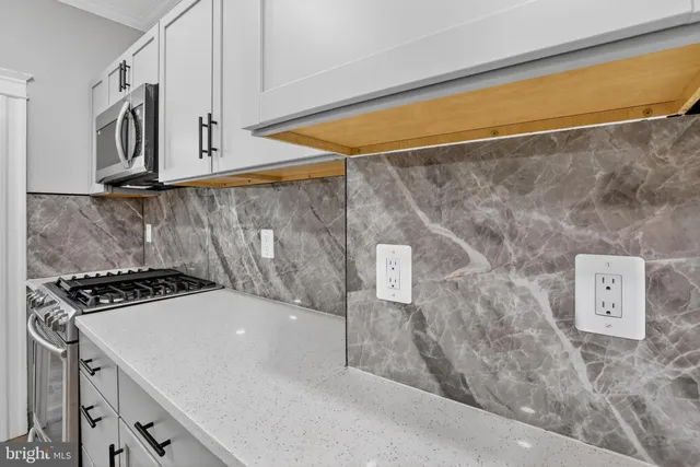 a kitchen with a stove and a sink