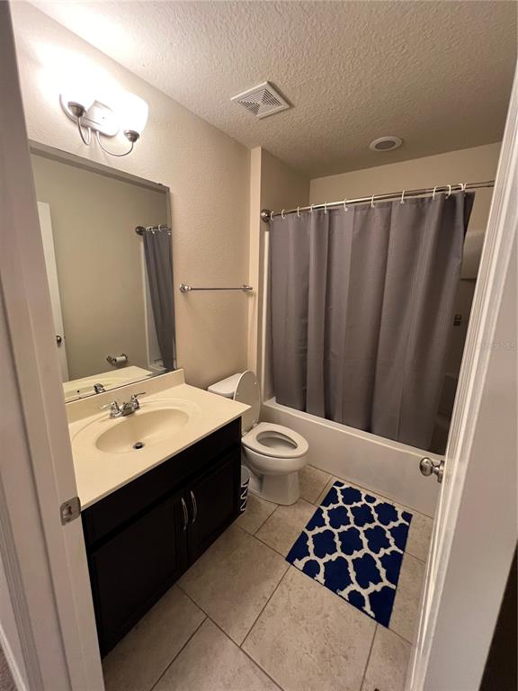 10742 Sunset Ridge Lane Orlando, FL 32832 - Photo 20 of 40 a bathroom with a sink toilet and shower