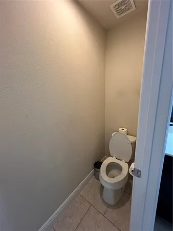 a view of hallway with wooden floor and stairs