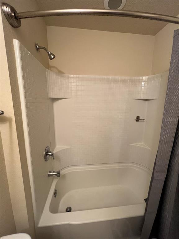 10742 Sunset Ridge Lane Orlando, FL 32832 - Photo 33 of 40 a bathroom with a bath tub