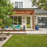 a front view of a house with garden
