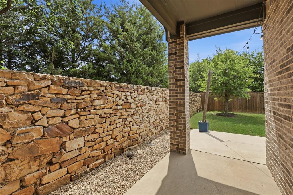 6212 Leatherstem Road Flower Mound, TX 76226 - Photo 27 of 40 Enjoy the Texas outdoors with mature landscaping and patio living.