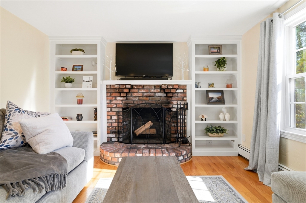 30 Huntington Road Plymouth, MA 02360 - Photo 9 of 35 a living room with furniture and a fireplace