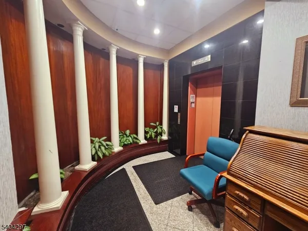 a view of a porch with wooden floor and stairs