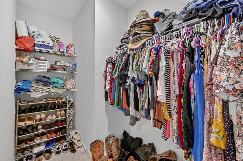 1809 Myrtlebrooke Drive Edgewater, FL 32141 - Photo 22 of 58 a view of walk in closet with clothes and shoes