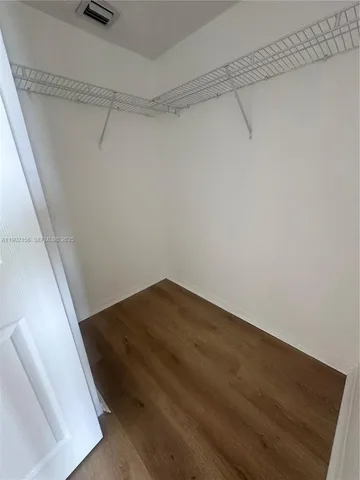 a room with a sink and a mirror