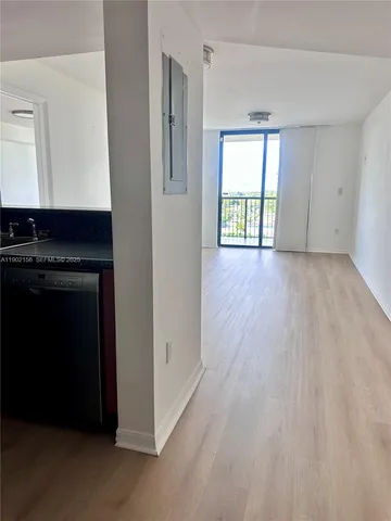 a view of a kitchen with a sink