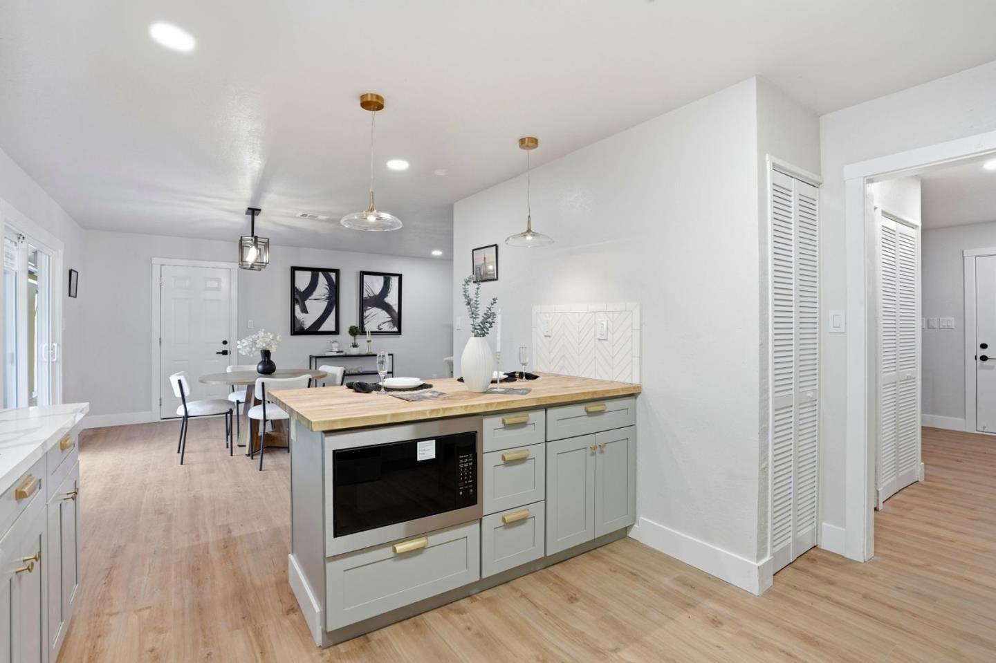 221 Pinon Avenue Pinole, CA 94564 - Photo 11 of 31 a kitchen with a stove and wooden floor