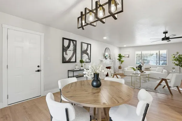a view of a dining room with furniture window and wooden floor