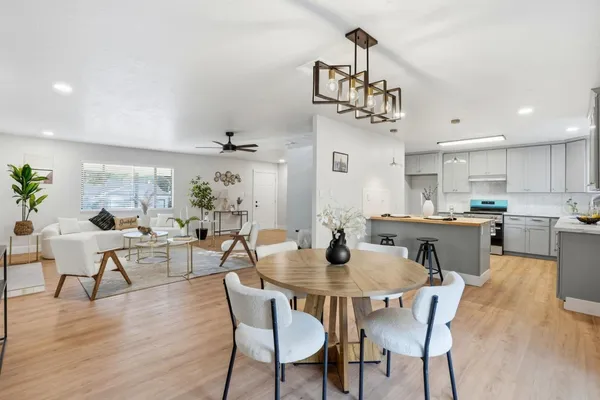 a view of a dining room with furniture and wooden floor