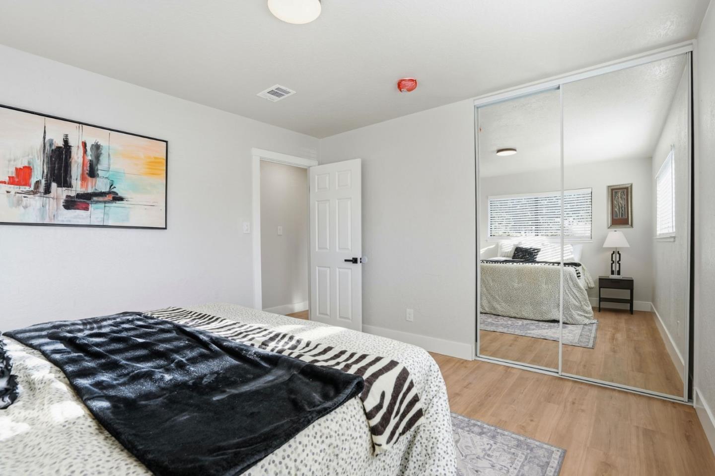 221 Pinon Avenue Pinole, CA 94564 - Photo 19 of 31 a bedroom with a bed and a view of kitchen