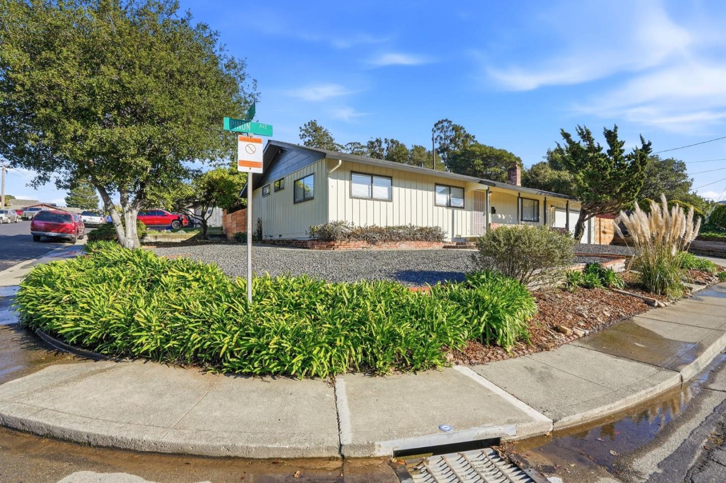 221 Pinon Avenue Pinole, CA 94564 - Photo 2 of 31 a front view of a house with a yard and potted plants