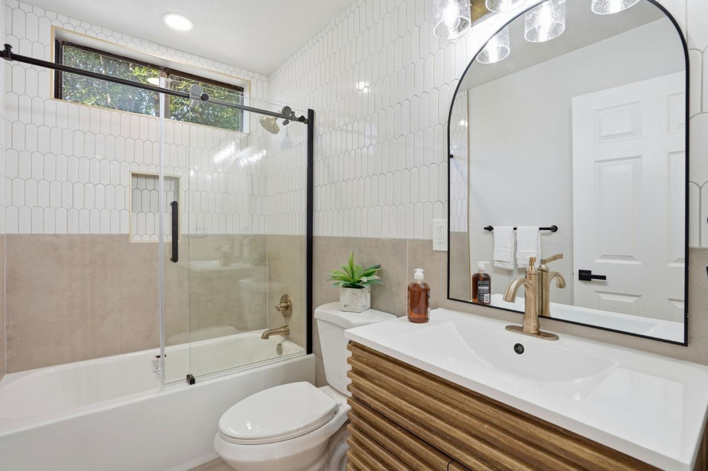 221 Pinon Avenue Pinole, CA 94564 - Photo 24 of 31 a bathroom with a sink a toilet and a mirror