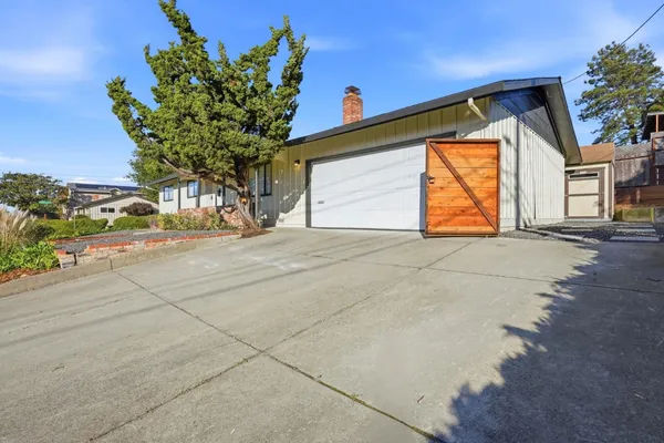 a view of a house with a street