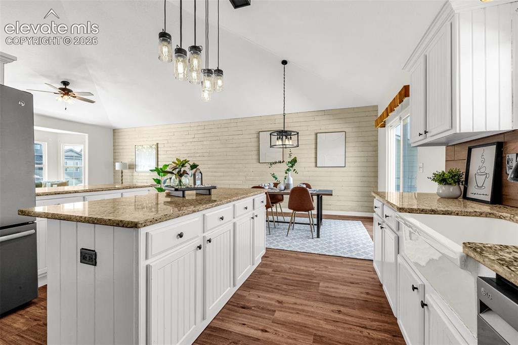 11185 Falling Star Road Fountain, CO 80817 - Photo 8 of 46 a kitchen with stainless steel appliances granite countertop a sink and a stove