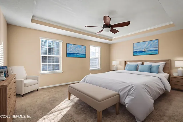 a spacious bedroom with a bed and furniture