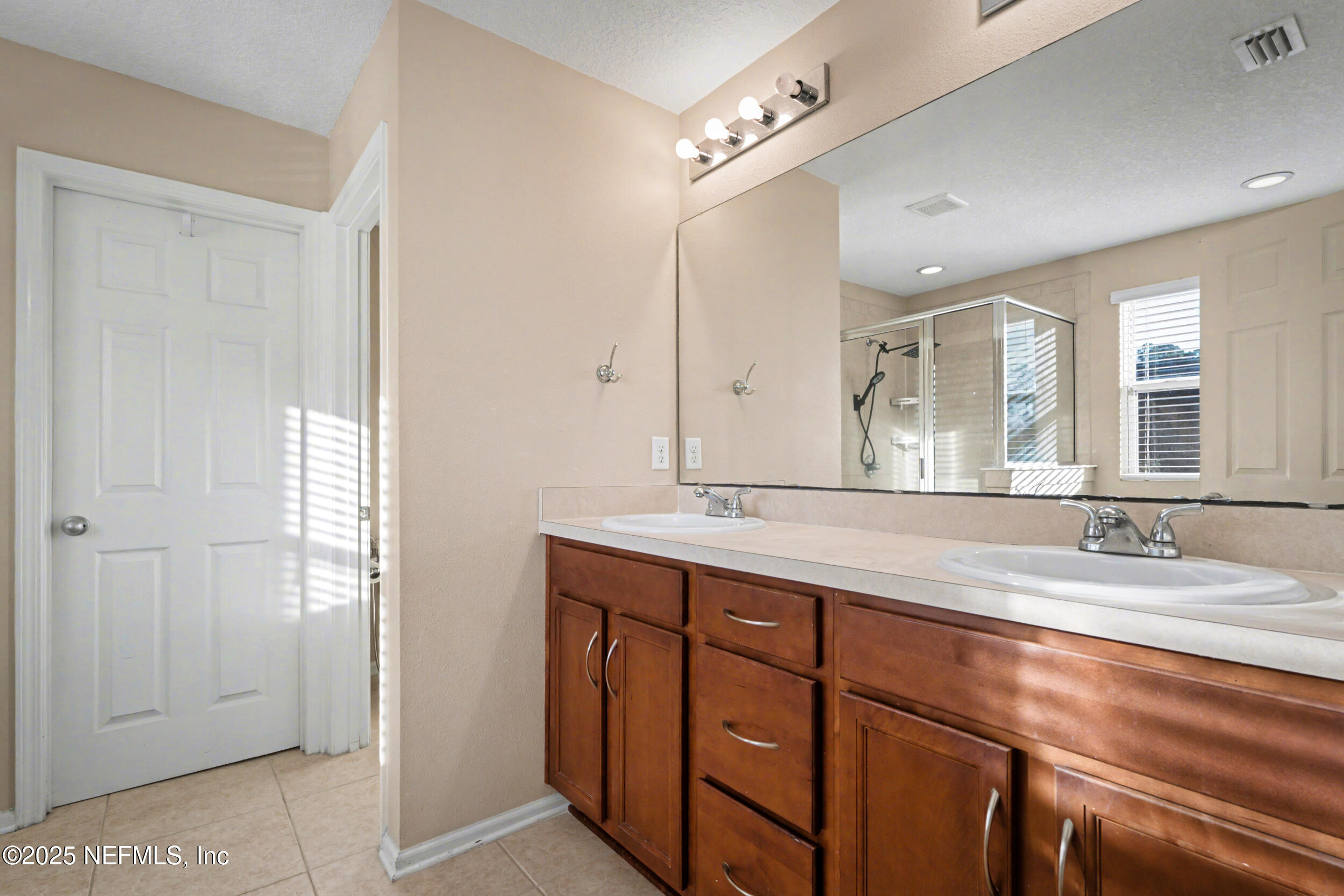 13697 Goodson Place Jacksonville, FL 32226 - Photo 18 of 28 a bathroom with a granite countertop sink mirror and double