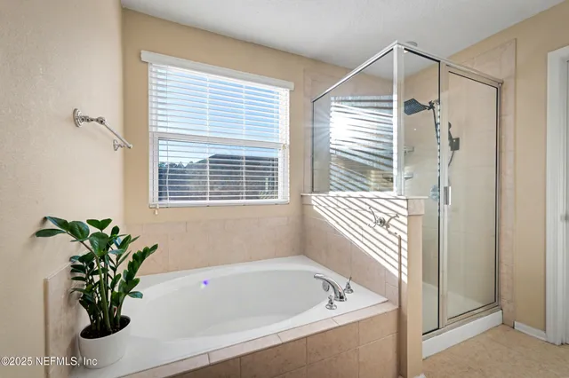 a bath tub sitting next to a window