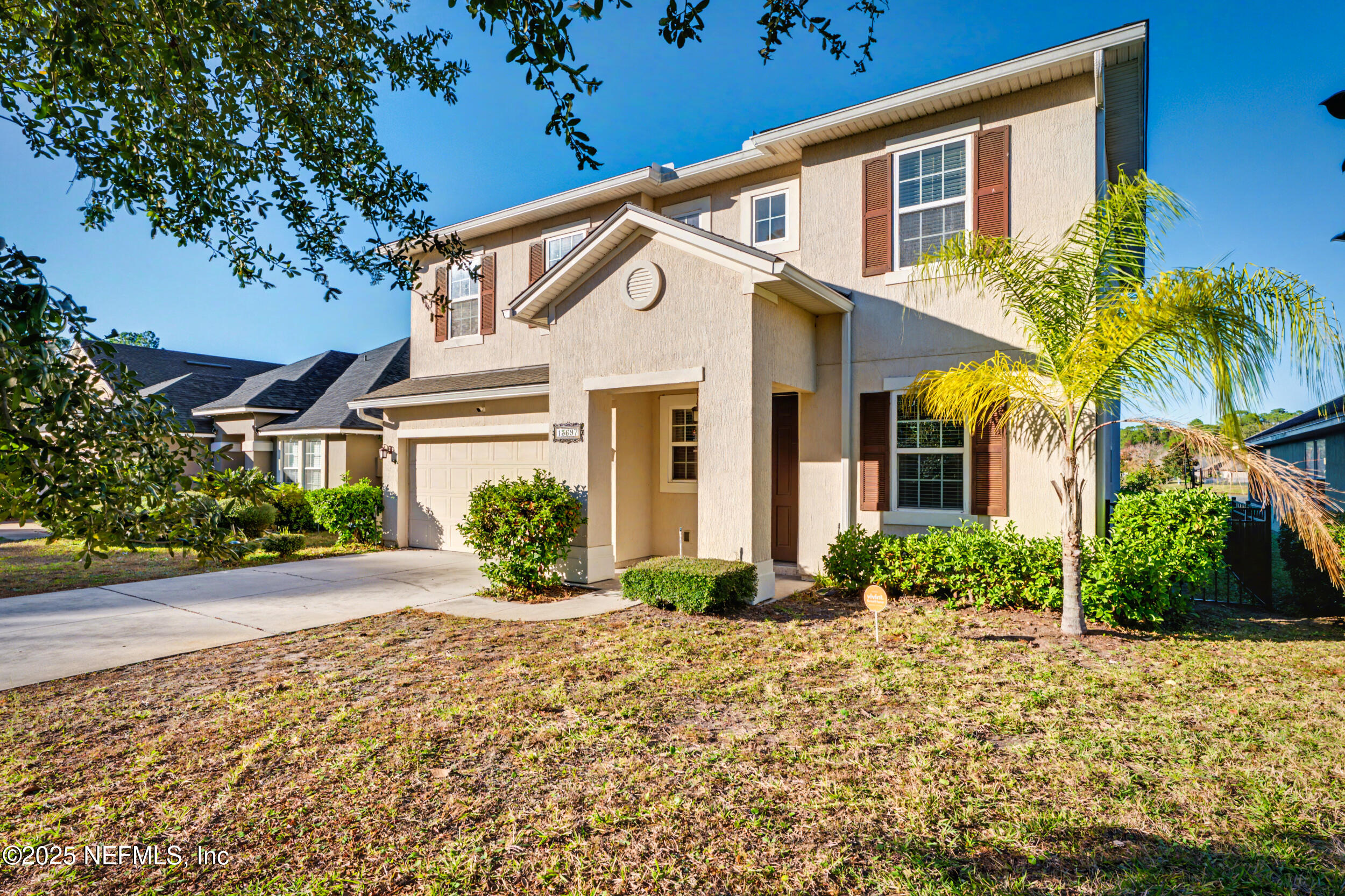 13697 Goodson Place Jacksonville, FL 32226 - Photo 2 of 28 a front view of a house with a yard
