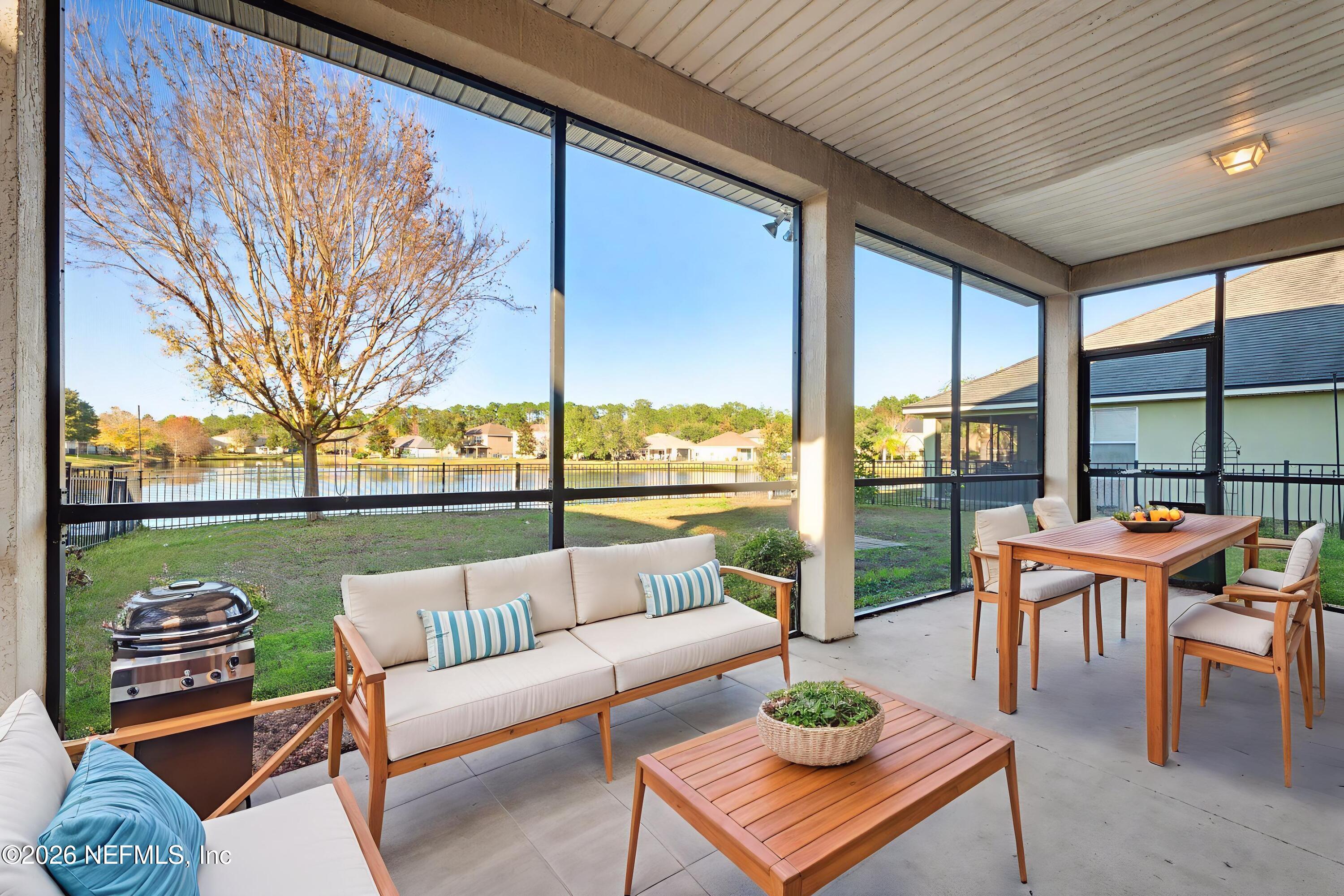 13697 Goodson Place Jacksonville, FL 32226 - Photo 25 of 28 a balcony with furniture and a large window