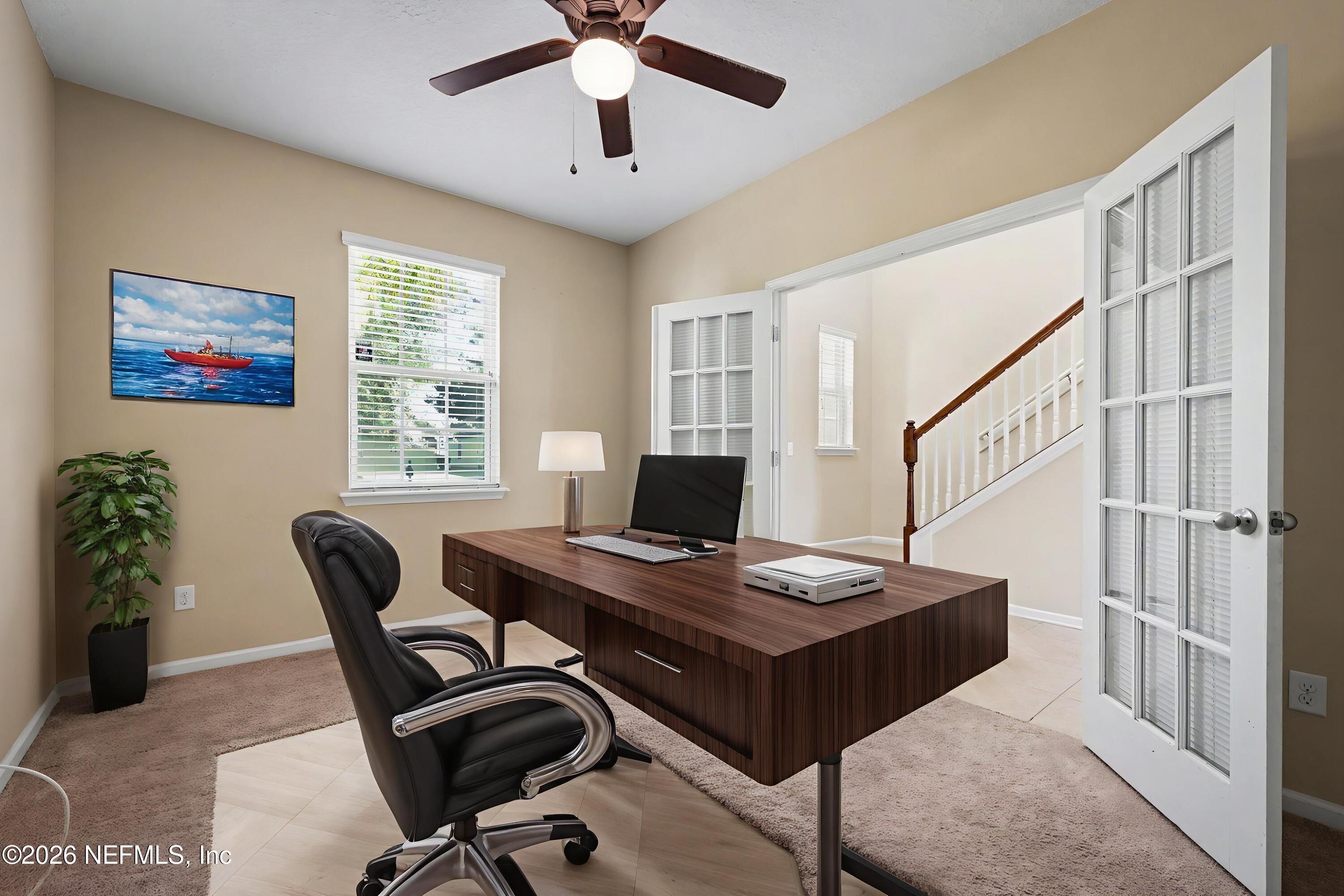 13697 Goodson Place Jacksonville, FL 32226 - Photo 5 of 28 a view of a workspace with furniture and a window